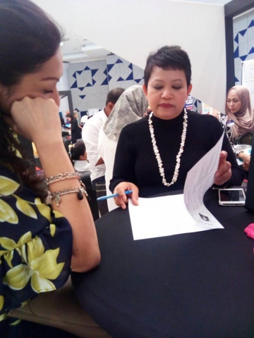 Photo of Hanie reviewing a participant's CV